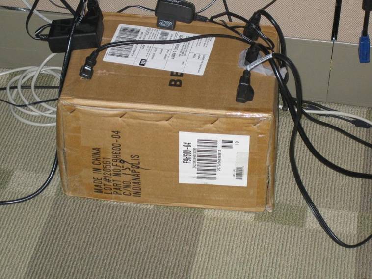 office prank - cardboard boxes as power surge power supply